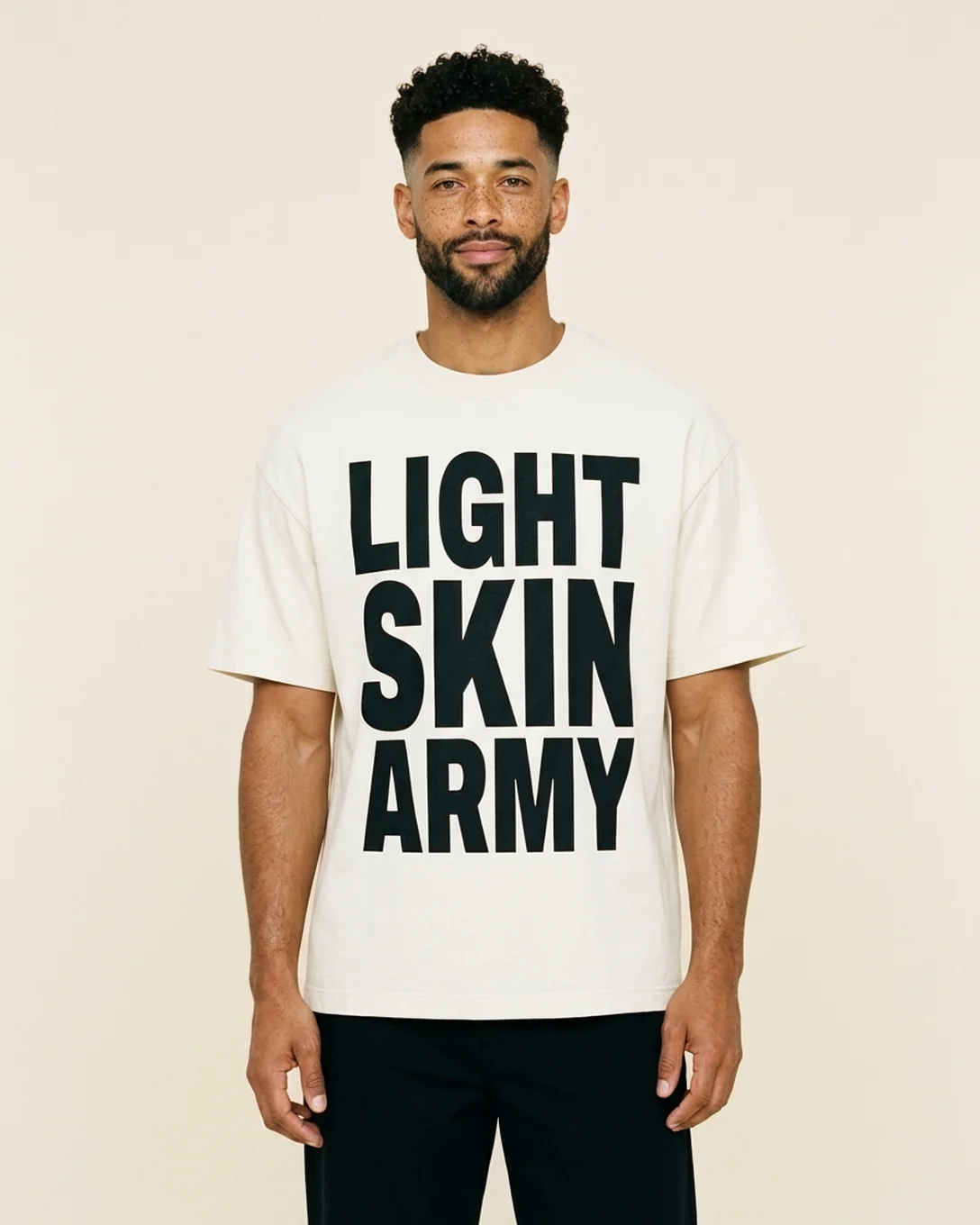 Model wearing the Light Skin Army Loud & Proud tee in Ivory with LIGHT SKIN ARMY stacked down the front